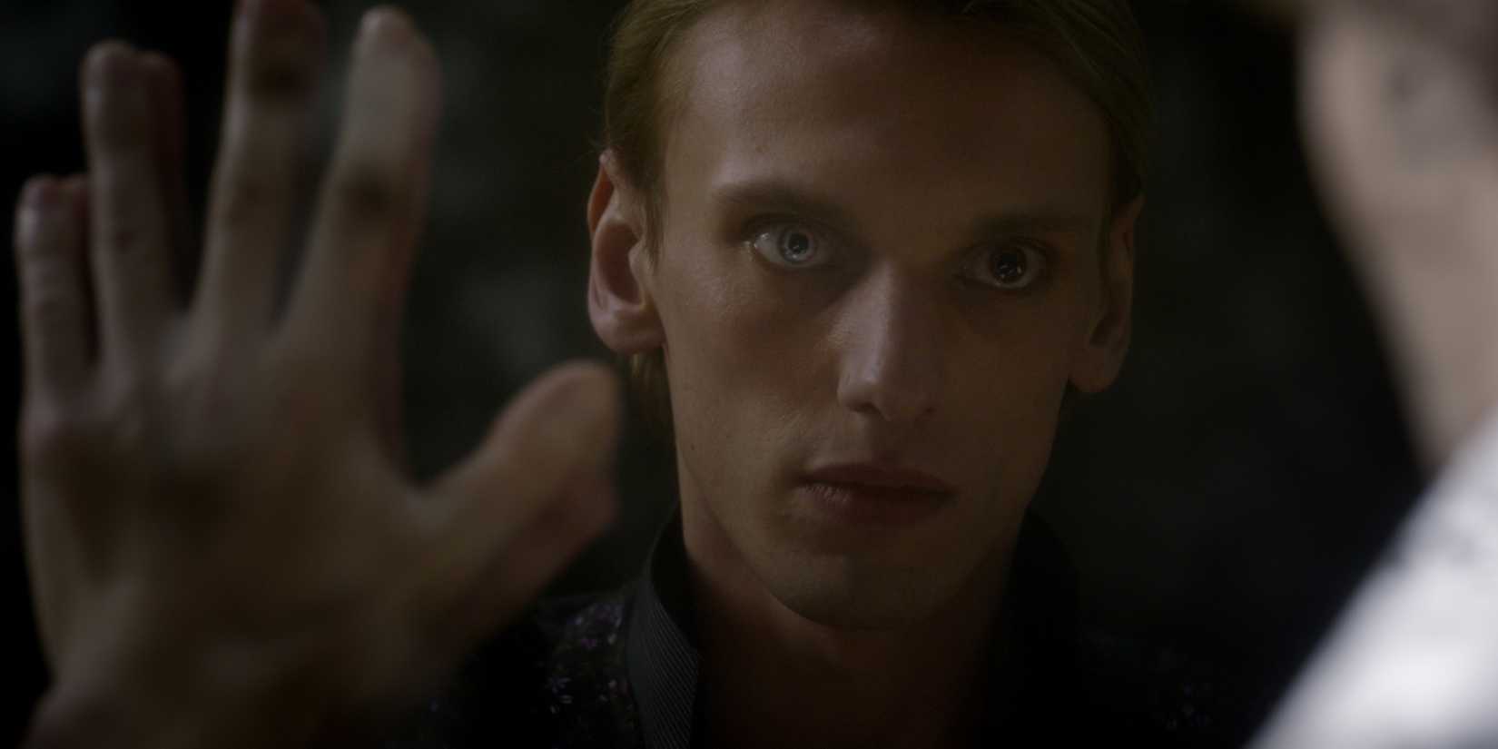Young Grindelwald touching hands with Dumbledore in Fantastic Beasts: The Crimes of Grindelwald