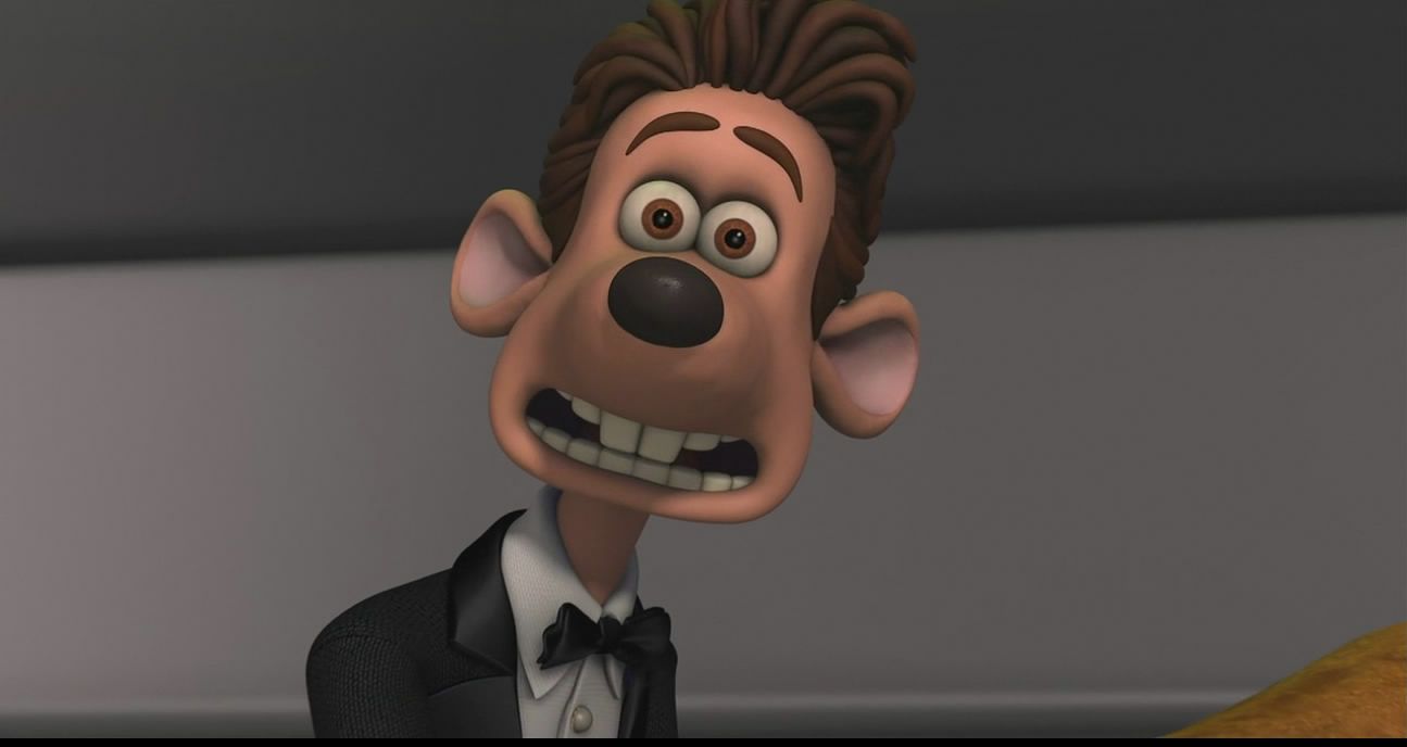 Roddy in Flushed Away wearing a tux and showing his teeth.