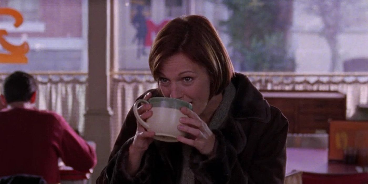 Nicole drinking coffee at Luke's diner on Gilmore Girls