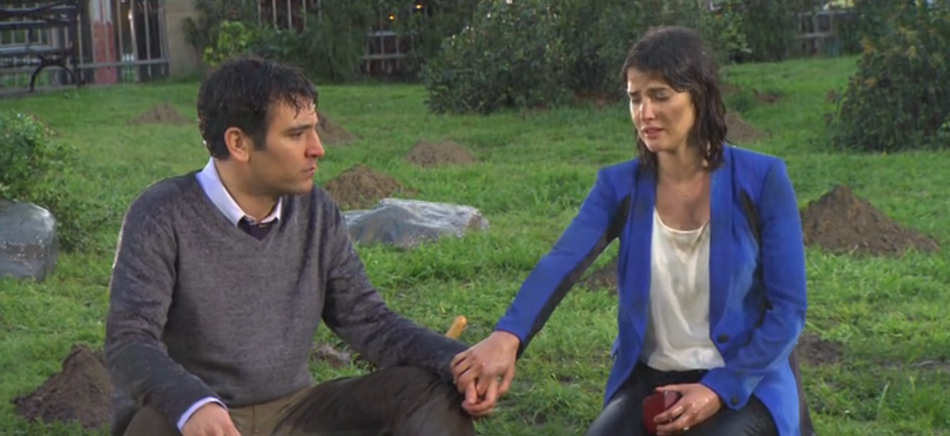 Ted and Robin sitting in the rain