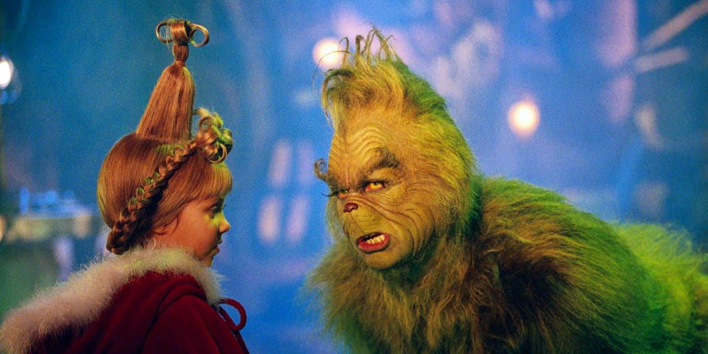 O Grinch conversando com Cindy Lou em How the Grinch Stole Christmas
