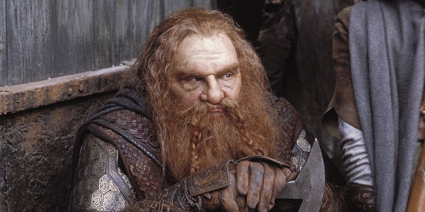 Gimli resting after a battle against Saruman's orcs in The Two Towers