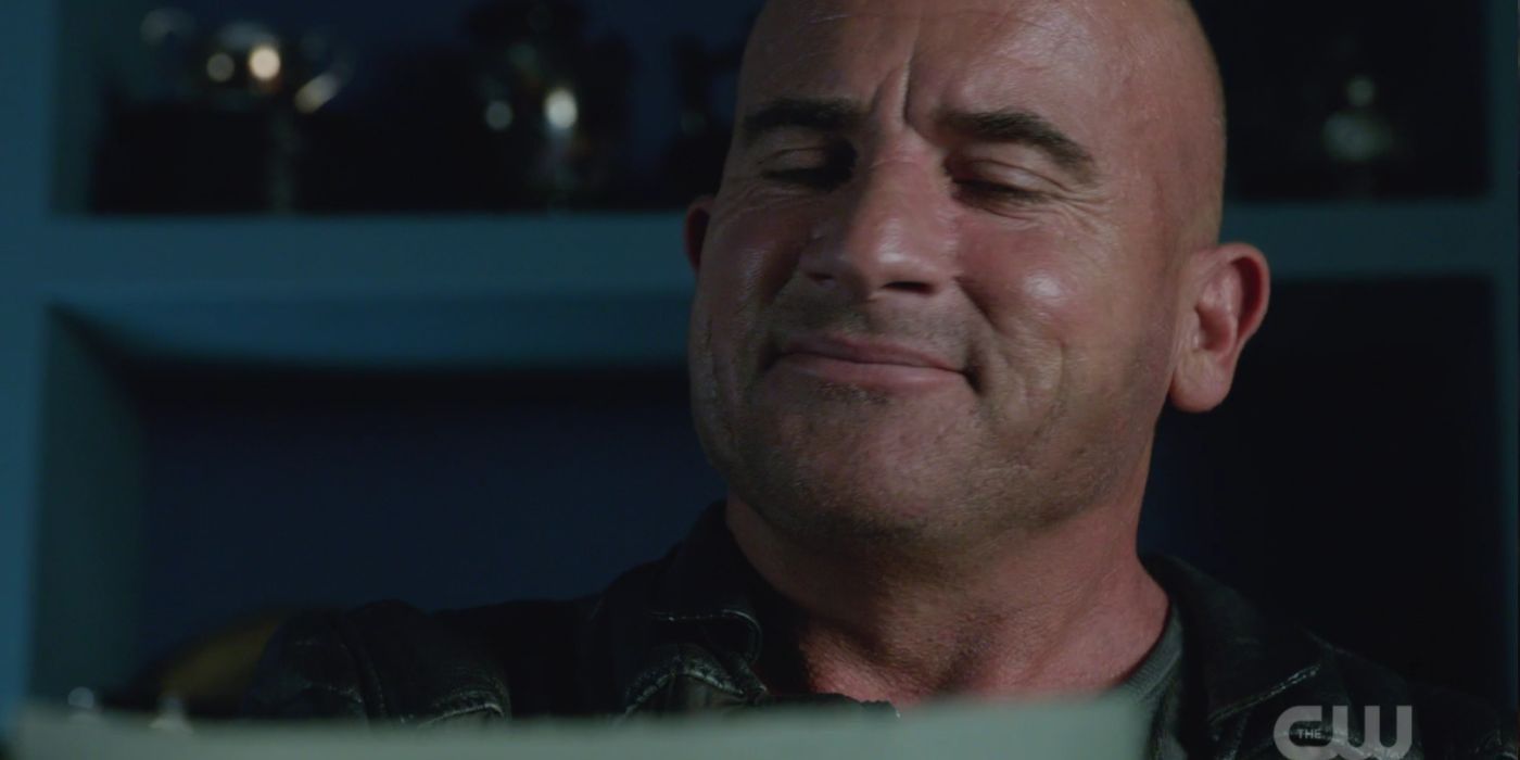 Mick Rory smiling while he is writing his novel in Legends of Tomorrow