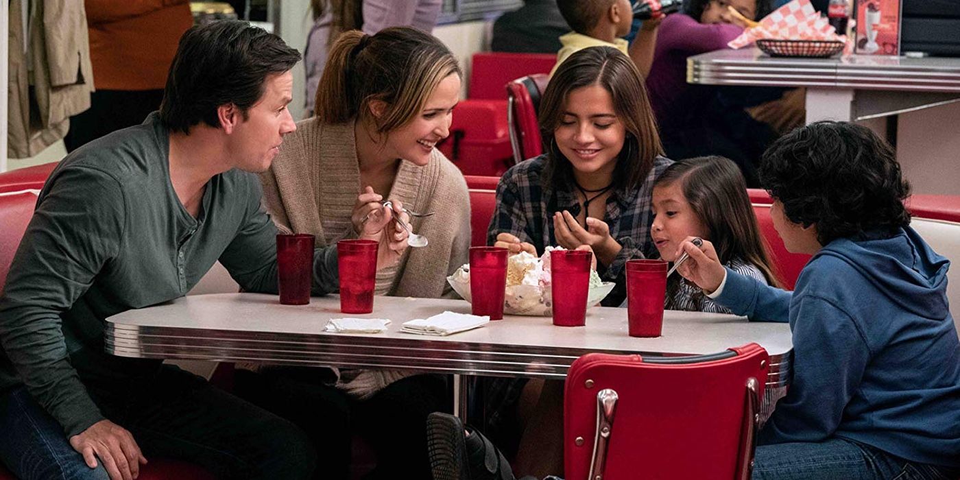 The family from Instant Family eat at a fast food joint together