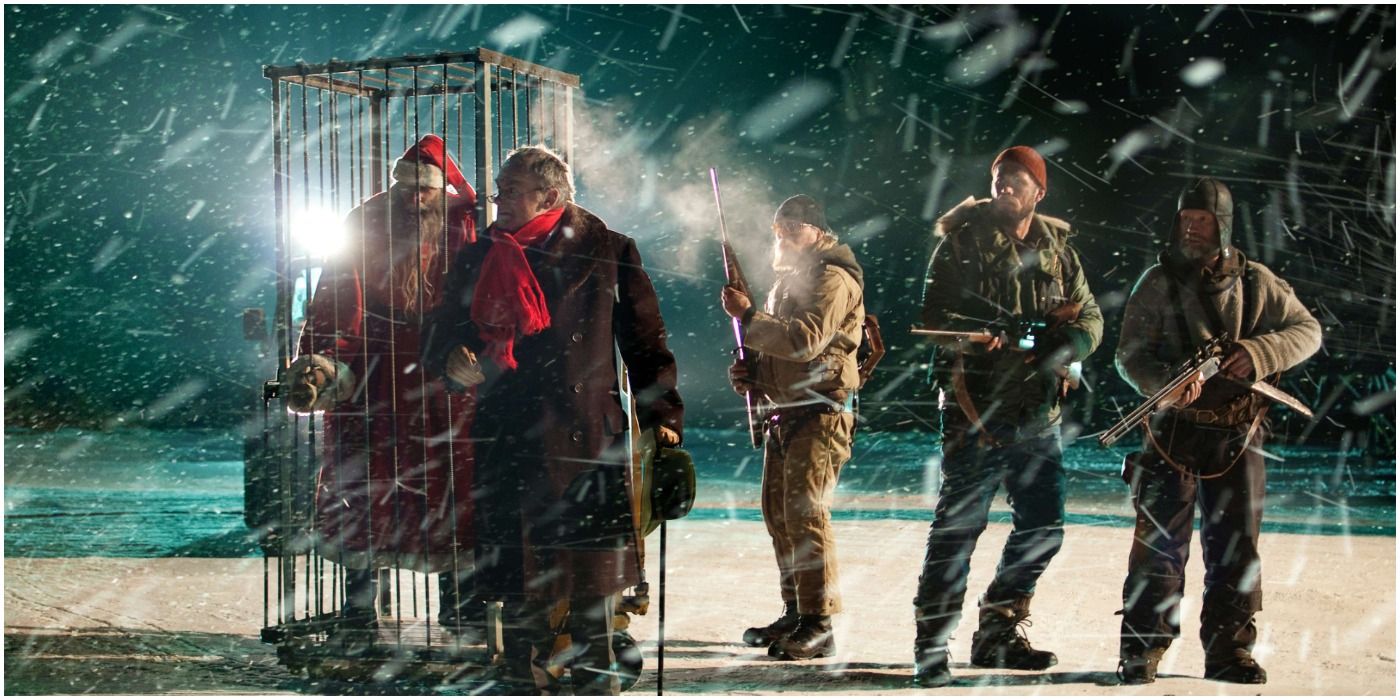 People standing around a caged Santa with guns in Rare Exports A Christmas Tale