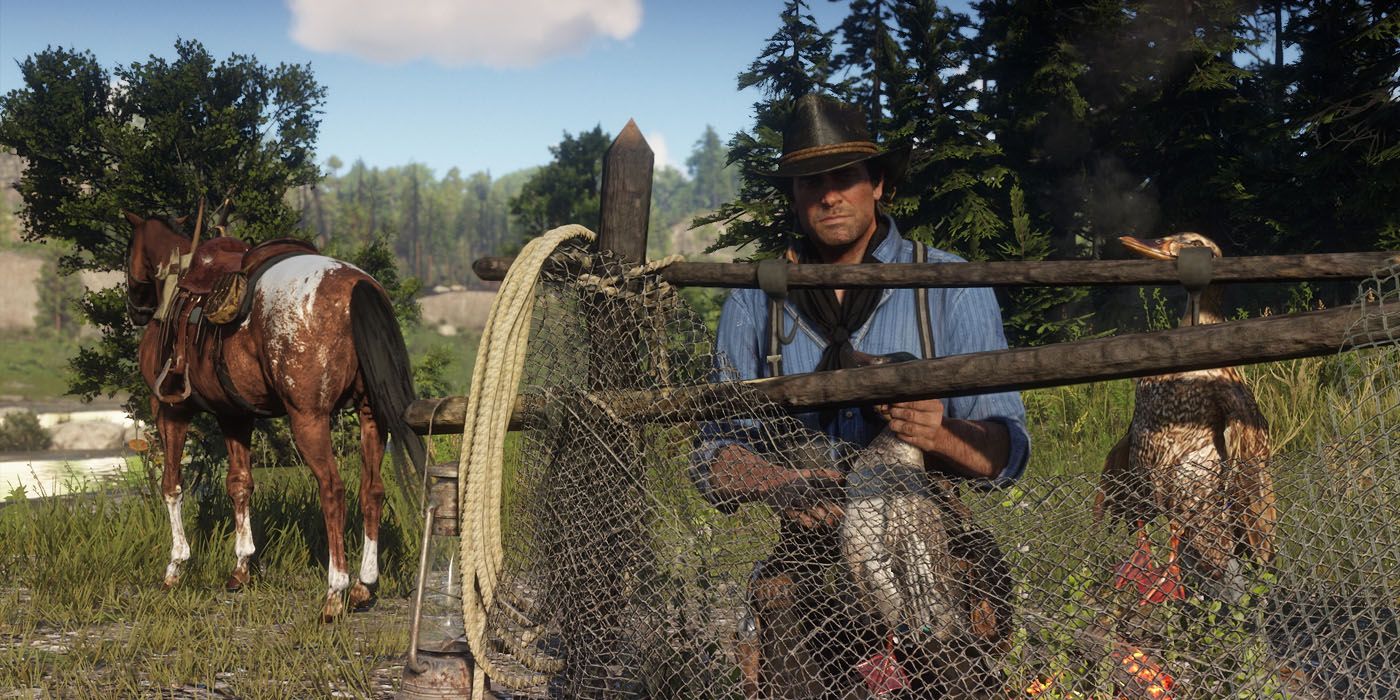 Red Dead Redemption 2's Appaloosa Horse standing in the background as Arthur stands behind a wire fence.
