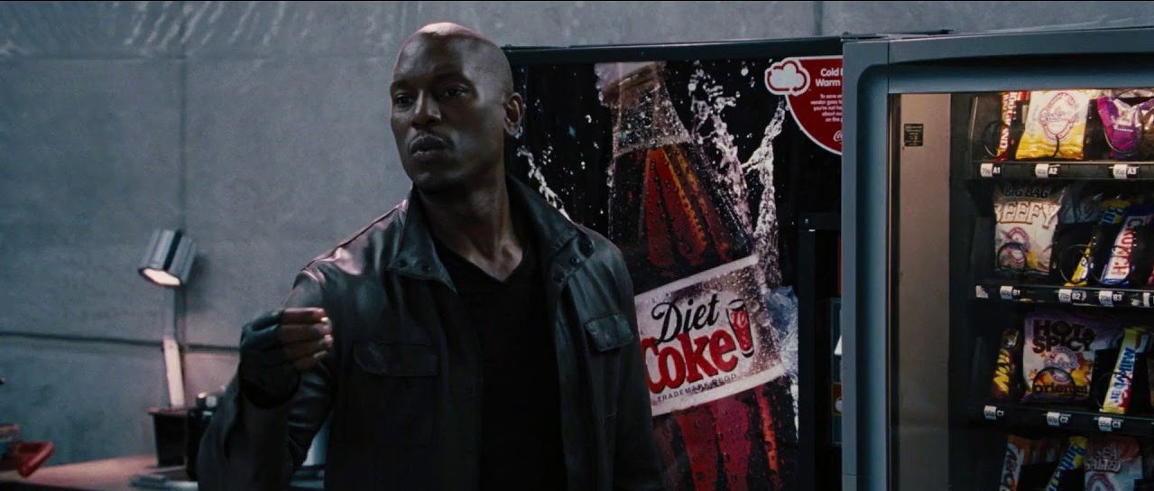 Roman uses a vending machine in Fast And Furious
