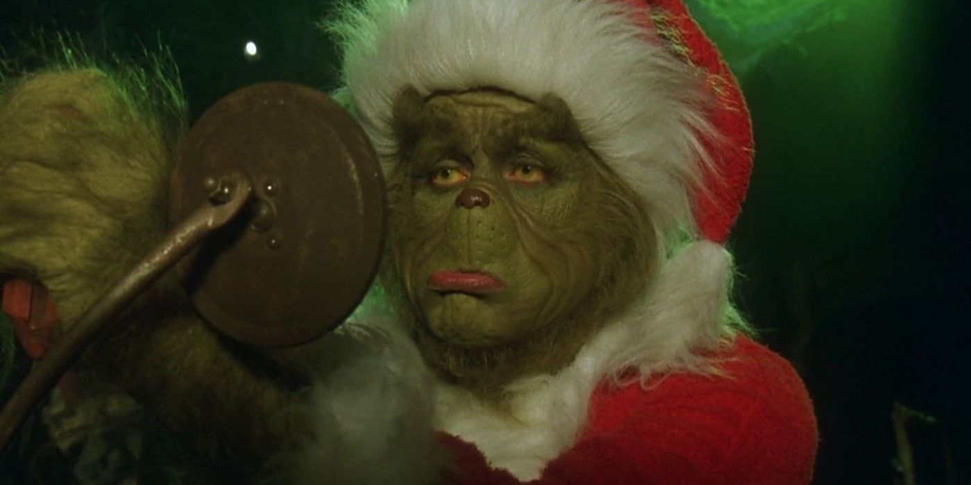 The Grinch looks sadly at his reflection in How the Grinch Stole Christmas
