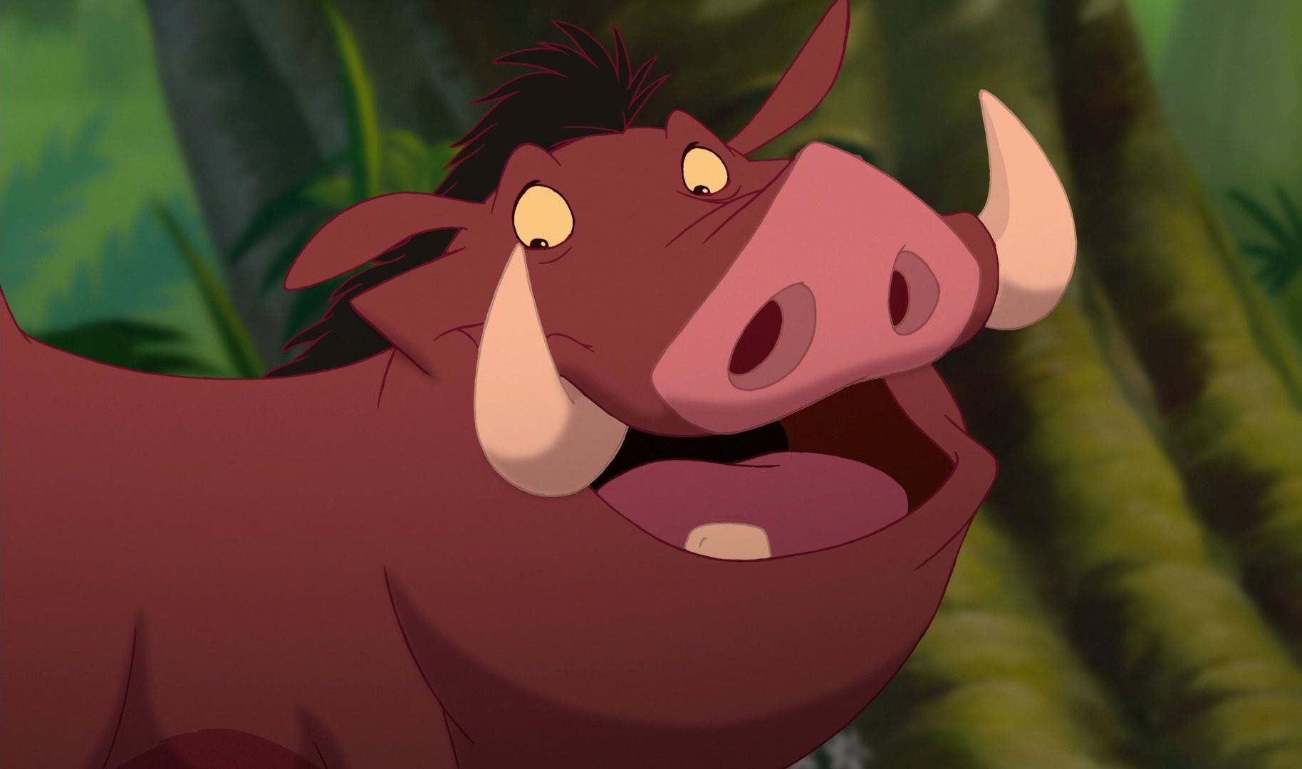 Pumbaa smiling and looking down in The Lion king