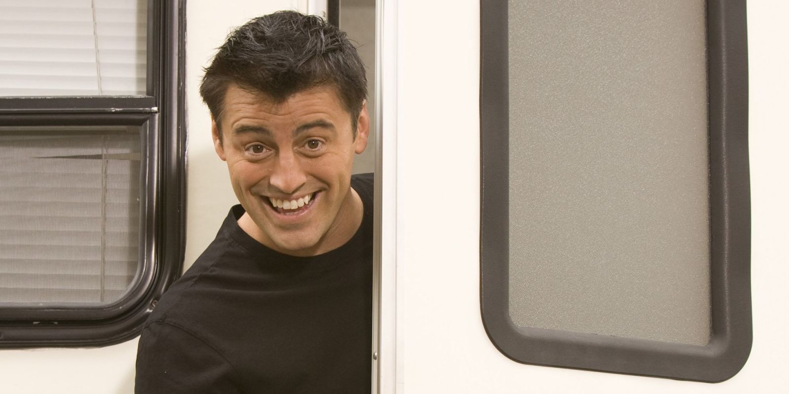 Joey exits a movie trailer in the spin-off, Joey