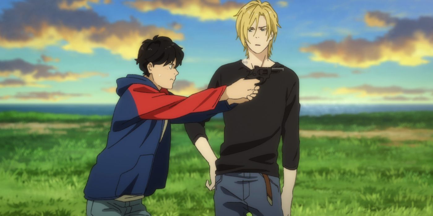 A young man poiints a gun while another man watches in Banana Fish.