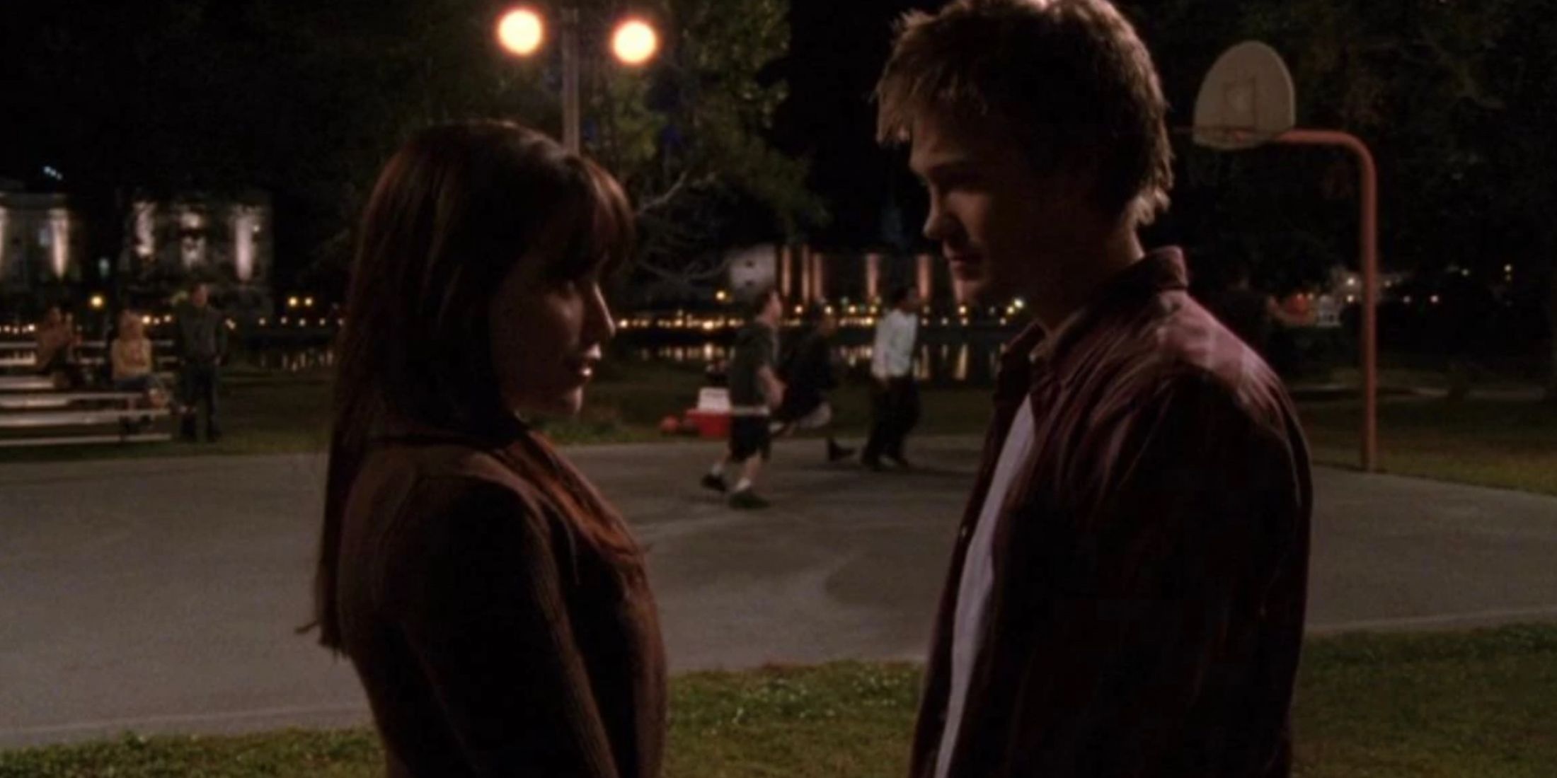 Brooke and Lucas talk next to the river court in One Tree Hill