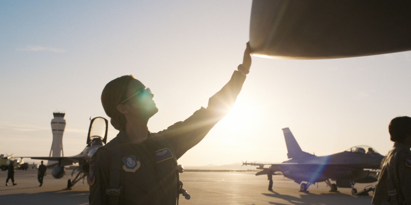 Carol checking out a plane in Captain Marvel.