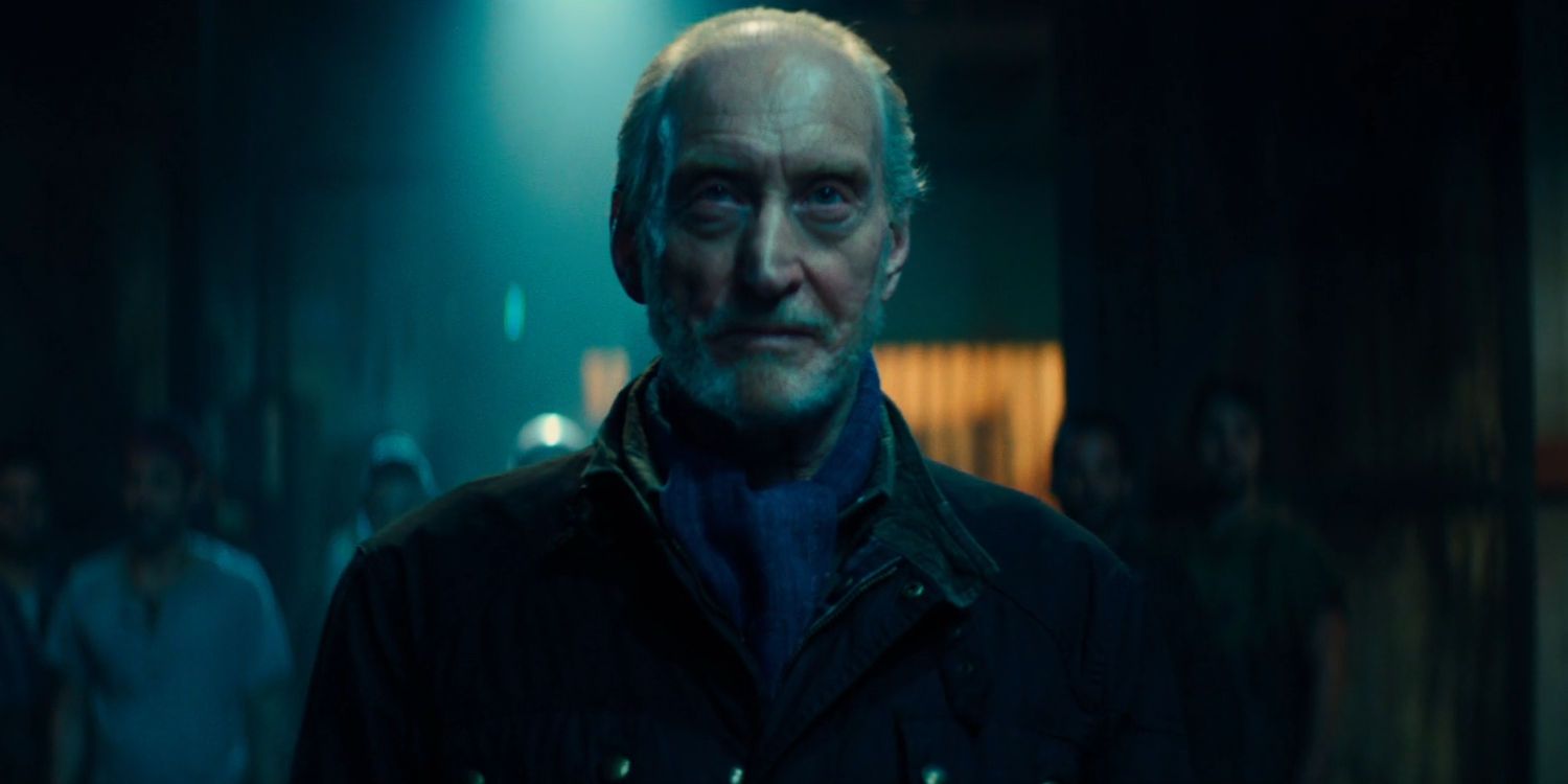 Charles Dance as Alan Jonah looking at the severed Ghidorah head in the post-credits scene of Godzilla King of the Monsters