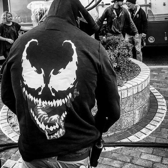 Crew member wears Venom hoodie on set