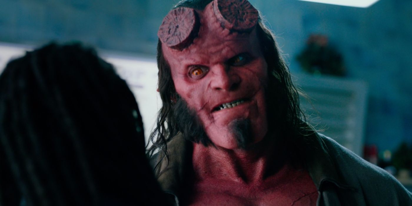 David Harbour as Hellboy talking to Sasha Lane