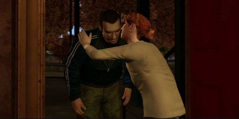 GTA IV scene with Kate McCreary embracing Niko Bellic and talking in his ear.