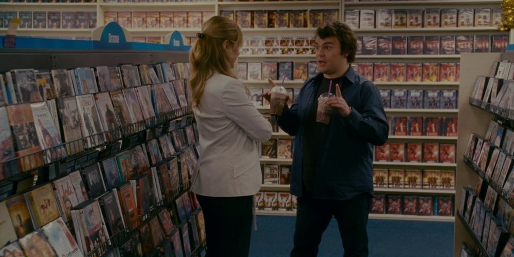Miles brings Iris drinks in the video store in The Holiday