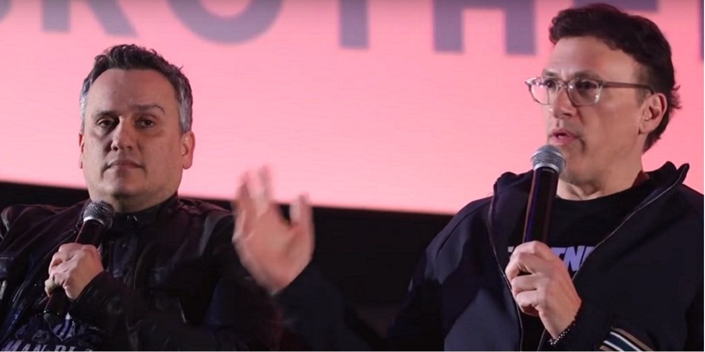 Joe and Anthony Russo speaking on a stage holding mics.