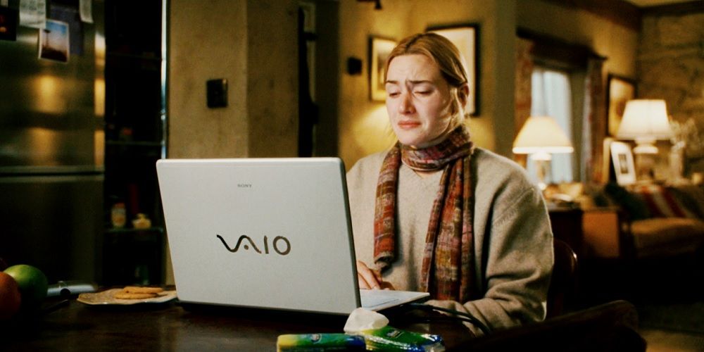 Iris cries at her laptop in The Holiday