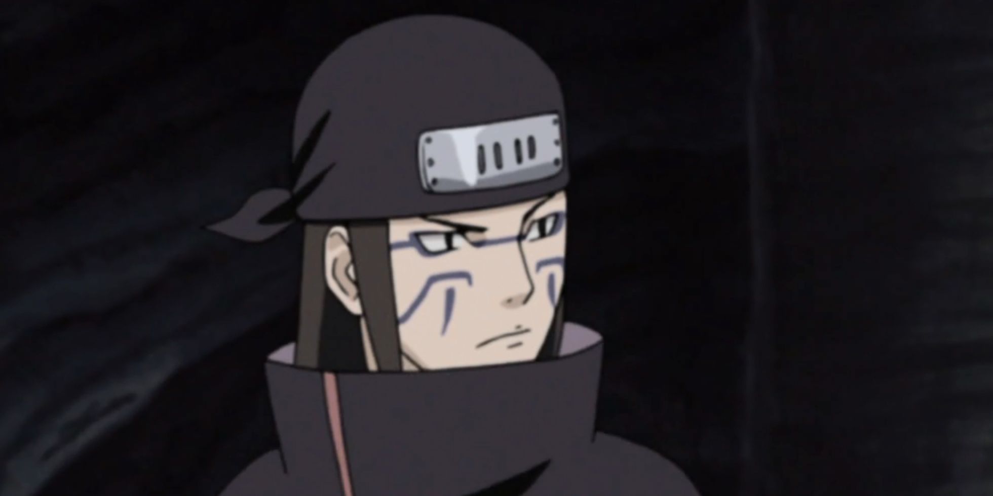 Kyusuke looks to the side in a cave in Naruto