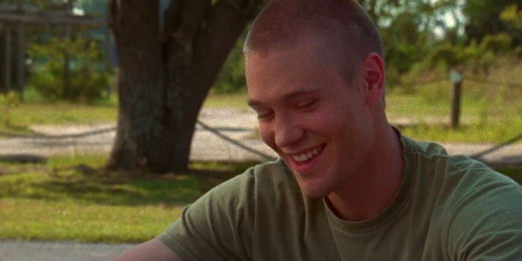 Lucas laughs at the river court in One Tree Hill
