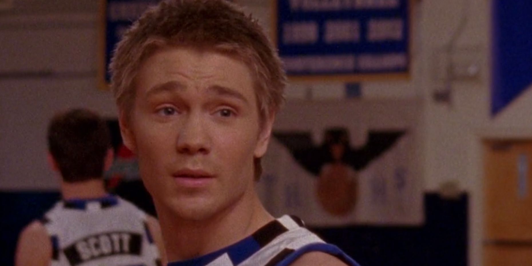 Lucas looks over his shoulder during the basketball game in the One Tree Hill season 1 finale