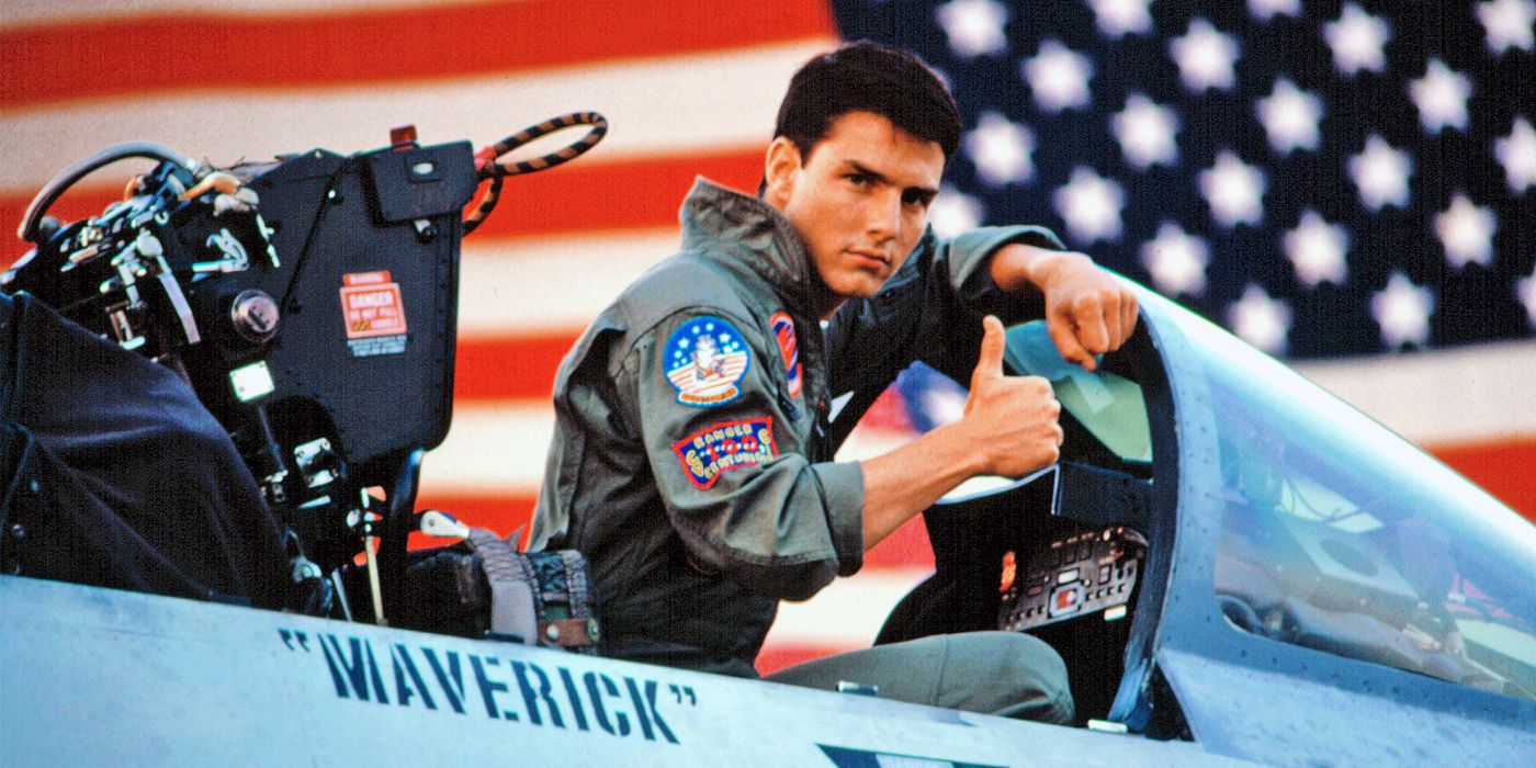 Maverick holding up his thumb sitting in cockpit in Top Gun