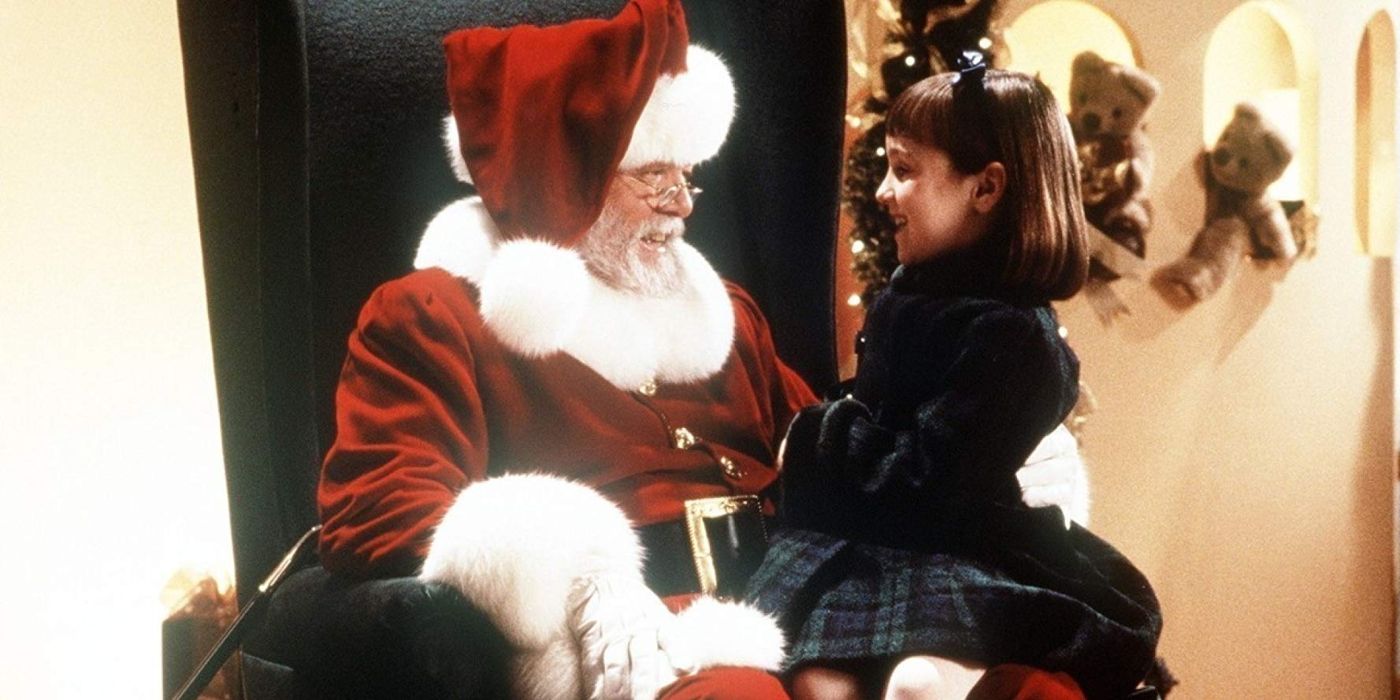 A little girl sitting in Santa's lap in Miracle on 34th Street remake