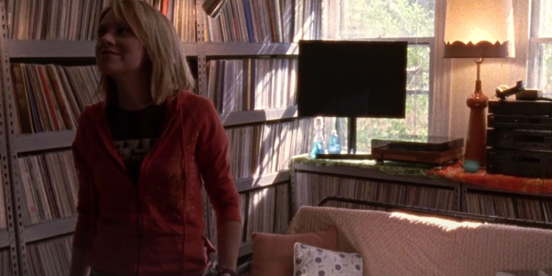 Peyton looks around Ellies record collection in One Tree Hill
