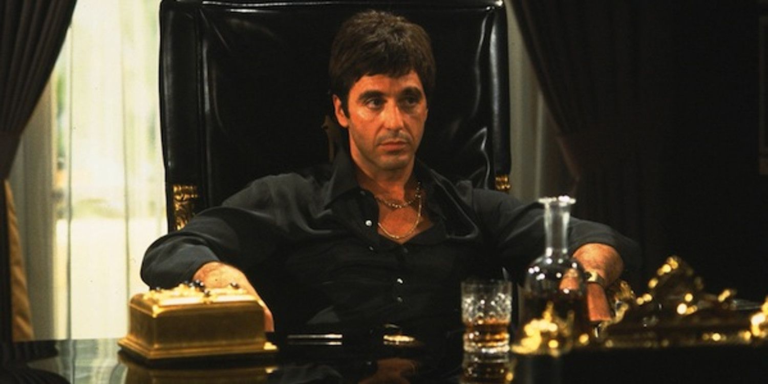 Tony sitting at his desk in Scarface