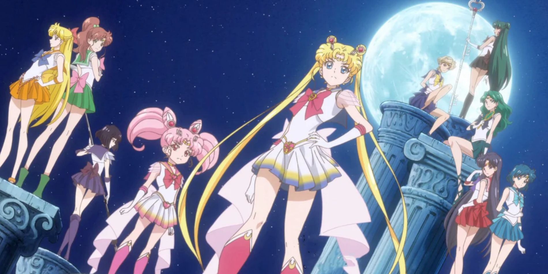 Sailor Moon stands at the front while her Sailor Senshi support her in what looks like the ruins of the Moon Kingdom in Sailor Moon Crystal