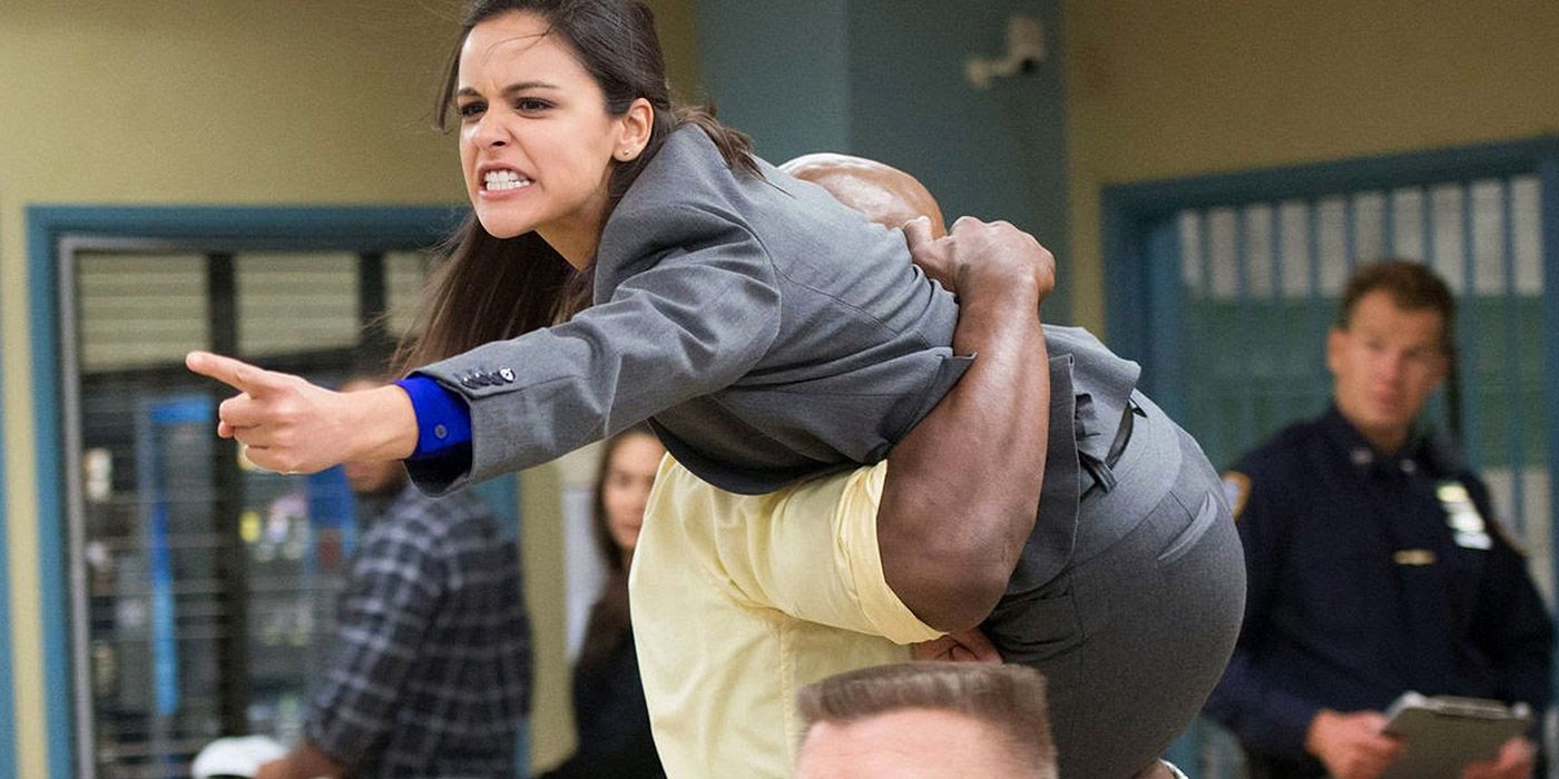 Terry carrying Amy over his shoulder in Brooklyn Nine-Nine