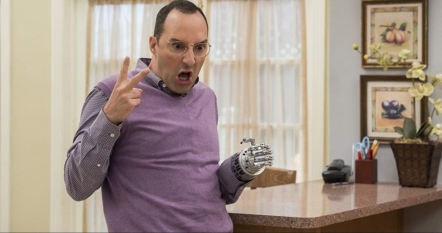 Buster in a kitchen with his hook hand in Arrested Development