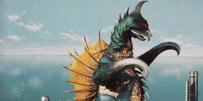 Gigan walking past buildings in a Godzilla movie