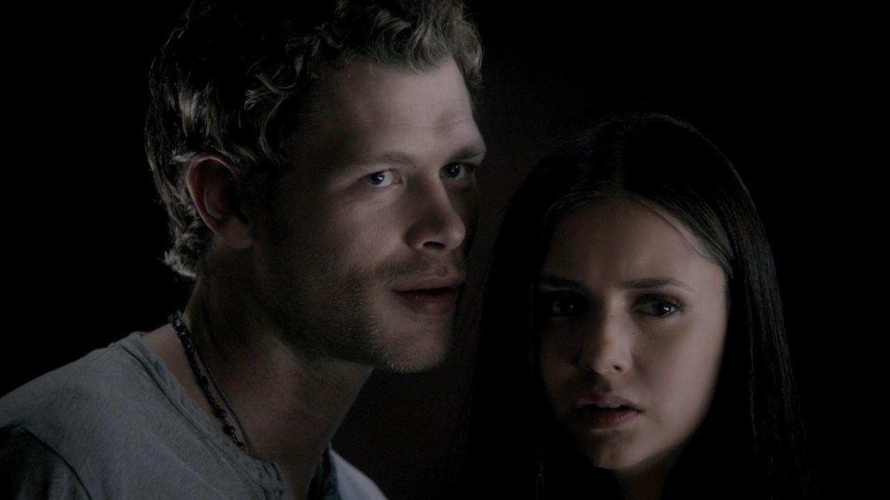 Klaus stands closely to Elena