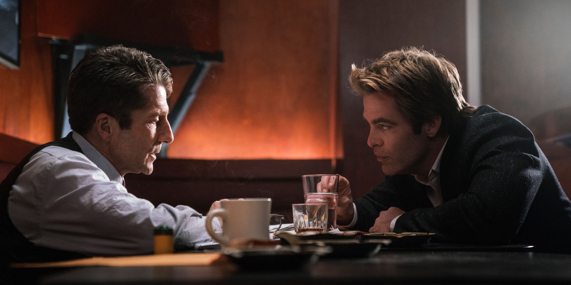 Leland Orser and Chris Pine talk in a bar in I Am The Night