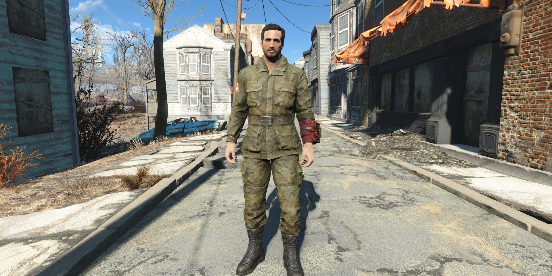 Player standing in the street wearing army fatigues in Fallout 4.