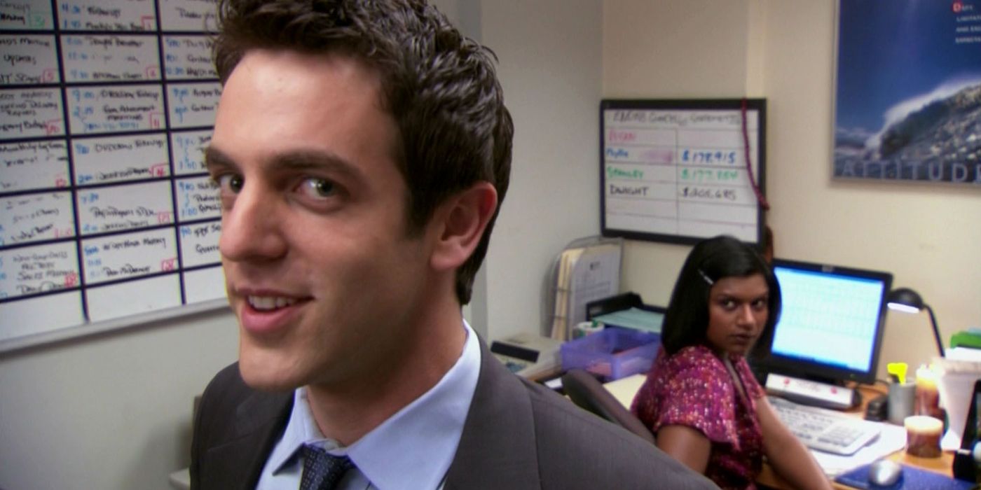 Ryan looking at the camera while Kelly looks at him in The Office.