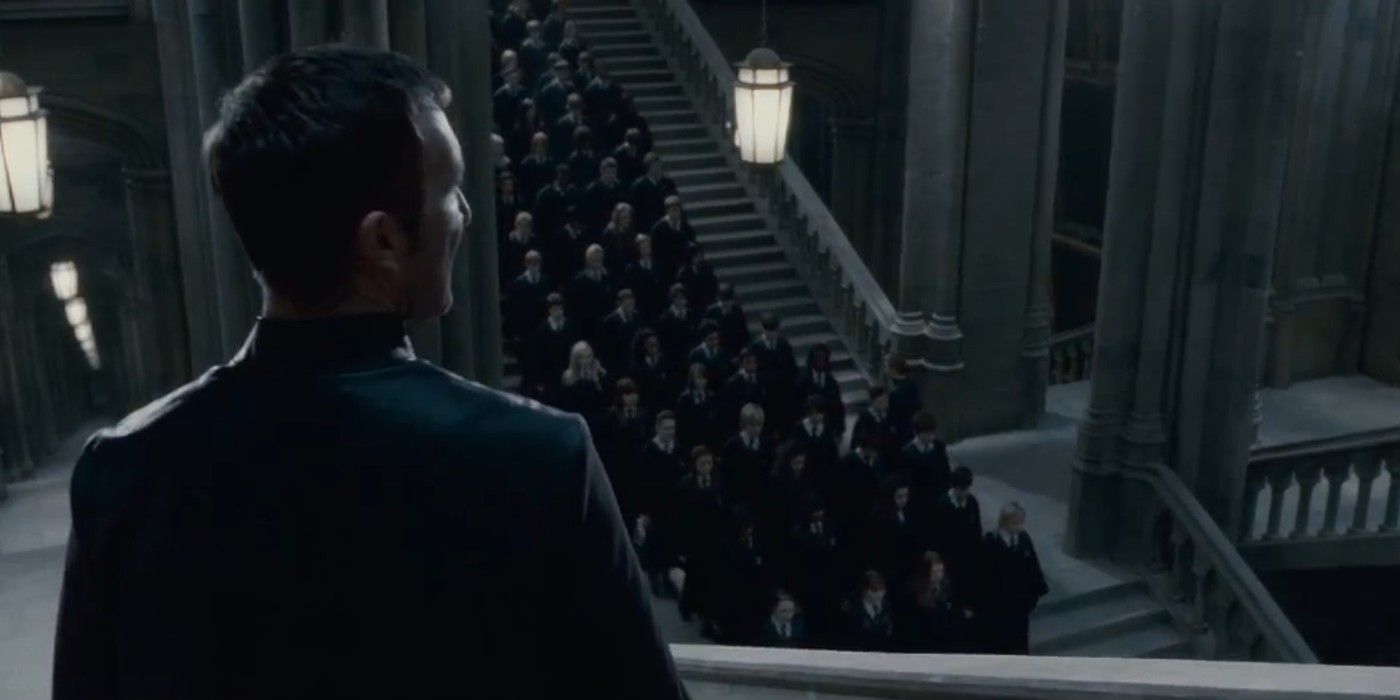 Amycus Carrow looking down at the students at Hogwarts in the Harry Potter movie franchise