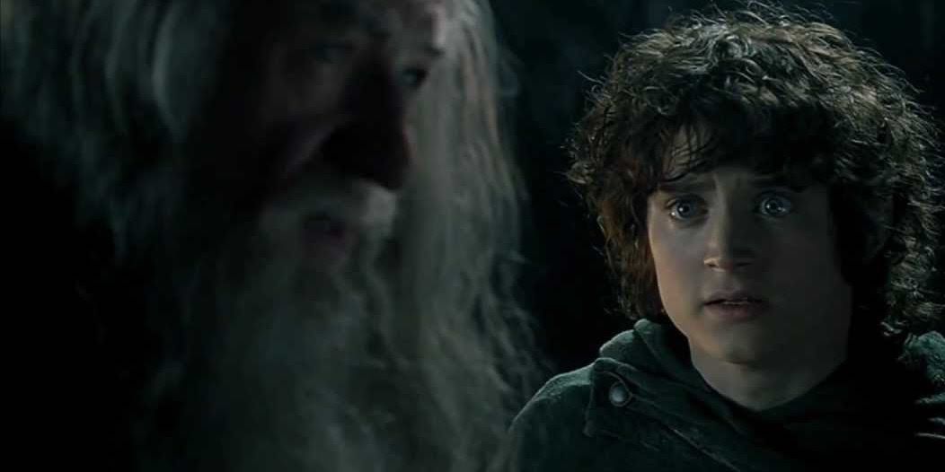 Frodo looking at Gandalf in the mines of Moria in The lord of the Rings The Fellowship of the Ring