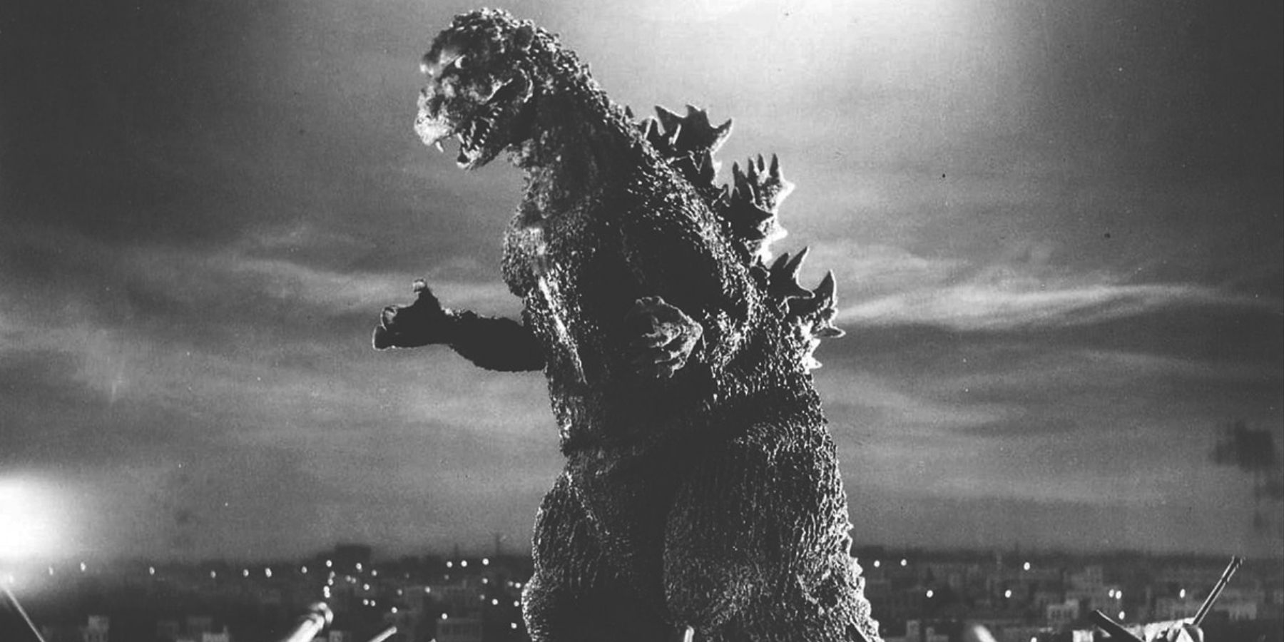 A black and white shot of Godzilla from the 1954 movie.