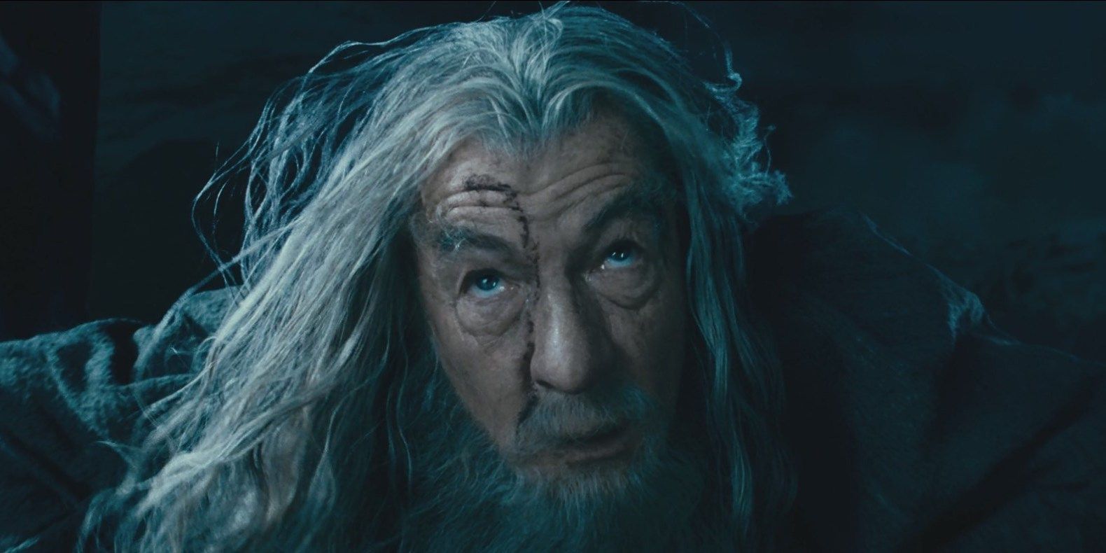Gandalf looking up Saruman on the top of Isengaard tower in The Lord of the Rings The Fellowship of the Ring