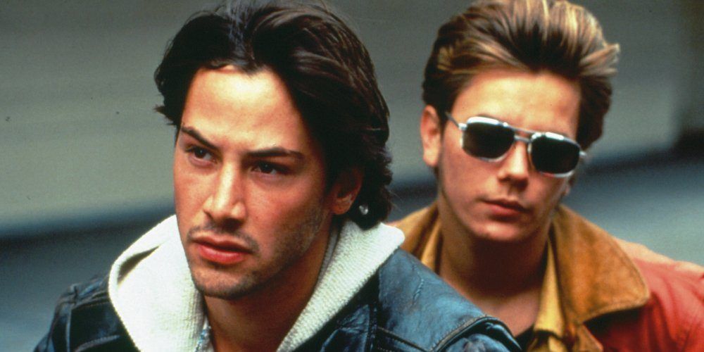 Keanu Reeves and River Phoenix on a motorcycle in My Own Private Idaho
