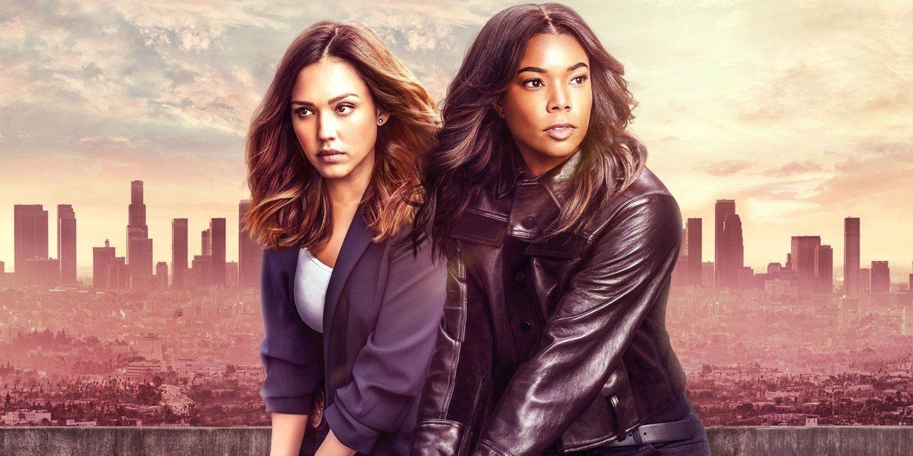 LA's Finest Promo Image with Jessica Alba And Gabrielle Union holding guns and standing next to each other