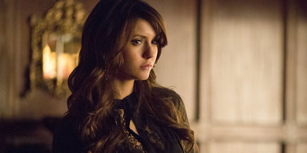 An image of Katherine standing in the Salvatore Boarding House in The Vampire Diaries