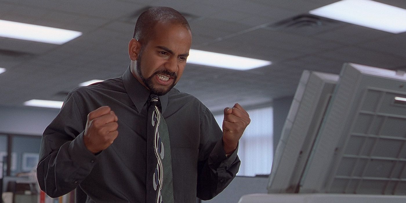 Samir rages at a printer in Office Space.