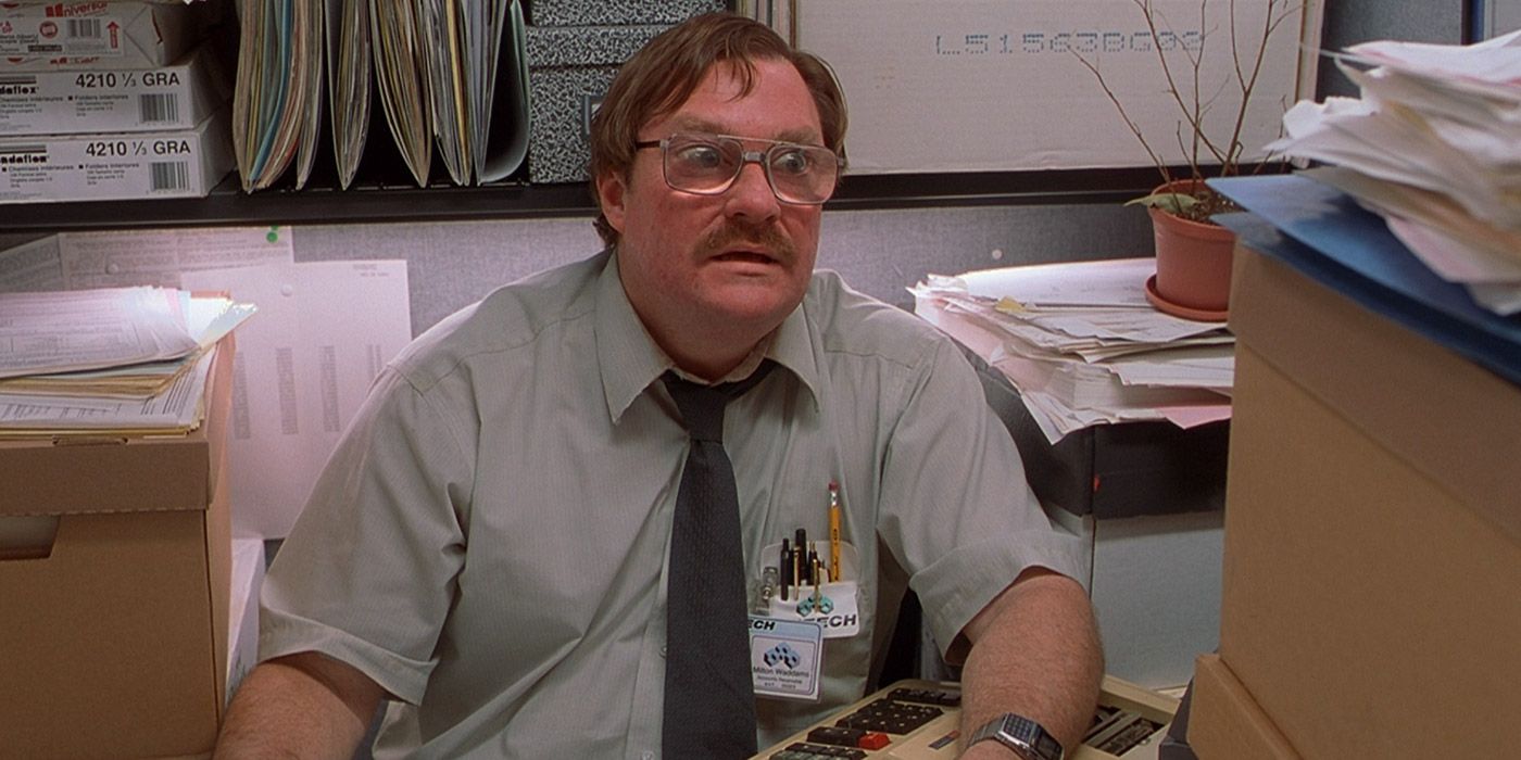 Milton at his desk in Office Space.