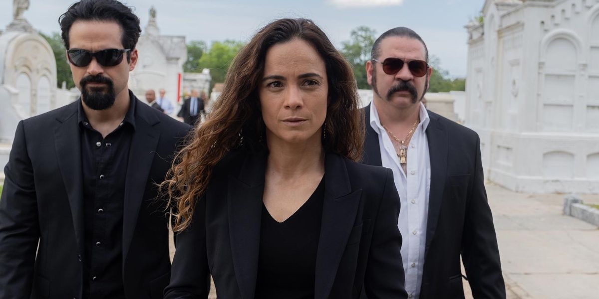 Teresa walking with henchmen in Queen of the South