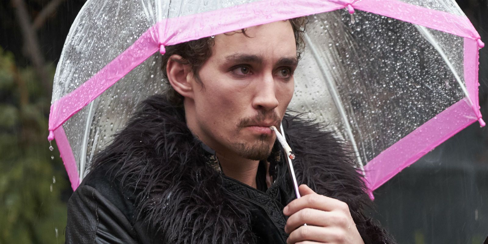 Klaus standing under the rain in The Umbrella Academy